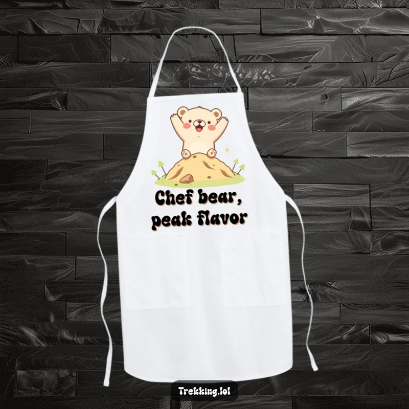 Funny apron featuring a joyful bear cheering after summiting a small hill, ideal for adding humor and personality to kitchen activities.