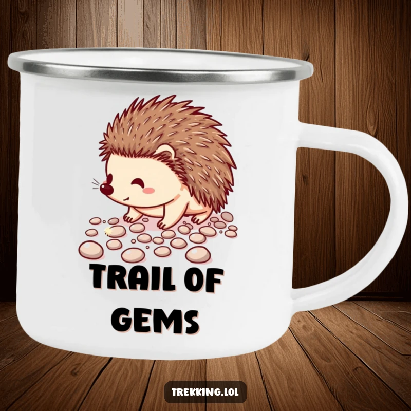 Funny enamel camping mug showing a cheerful hedgehog carefully walking on a path of sparkling pebbles, for outdoor use.