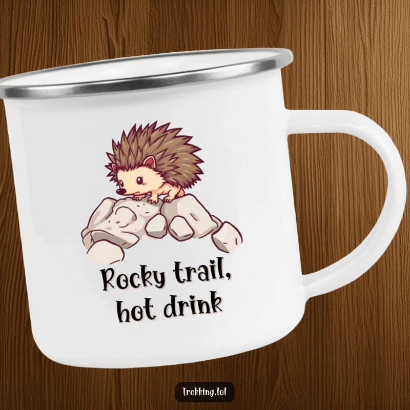 Funny camping mug with a determined hedgehog carefully navigating over rocky terrain, perfect for outdoor use.