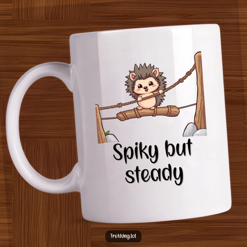 Funny mug featuring a determined hedgehog carefully crossing a wobbly rope bridge over a gap, showing bravery and focus.