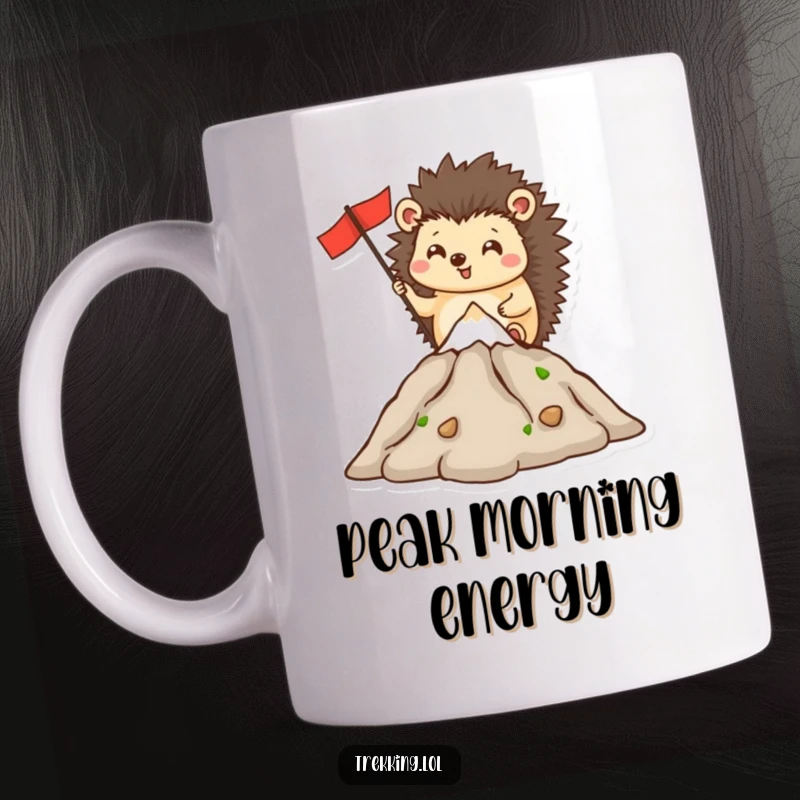 Funny mug with a happy hedgehog character triumphantly planting a flag on a miniature mountain peak, symbolizing achievement.