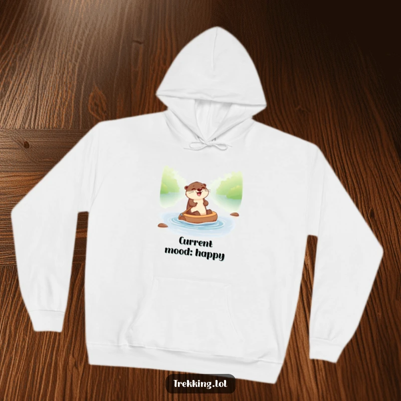 Funny otter hoodie showcasing a giggling otter joyfully paddling a tiny raft down a river, designed for comfort and fun.