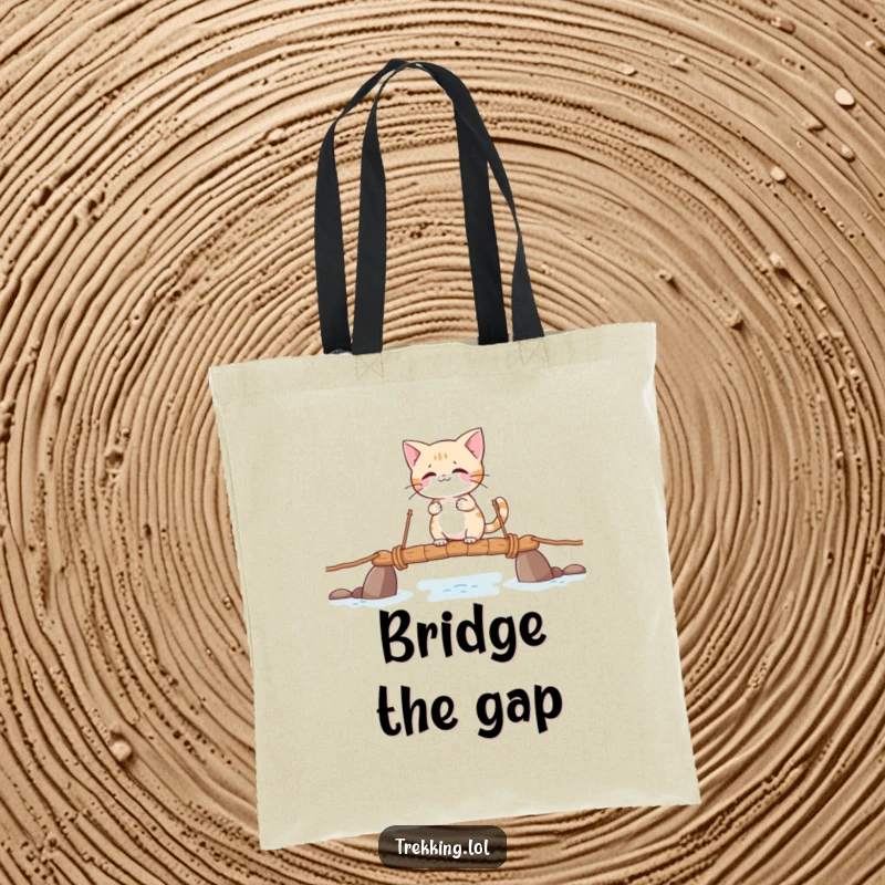 Funny tote bag with a giggling cat character carefully crossing a shaky rope bridge, great for everyday use.